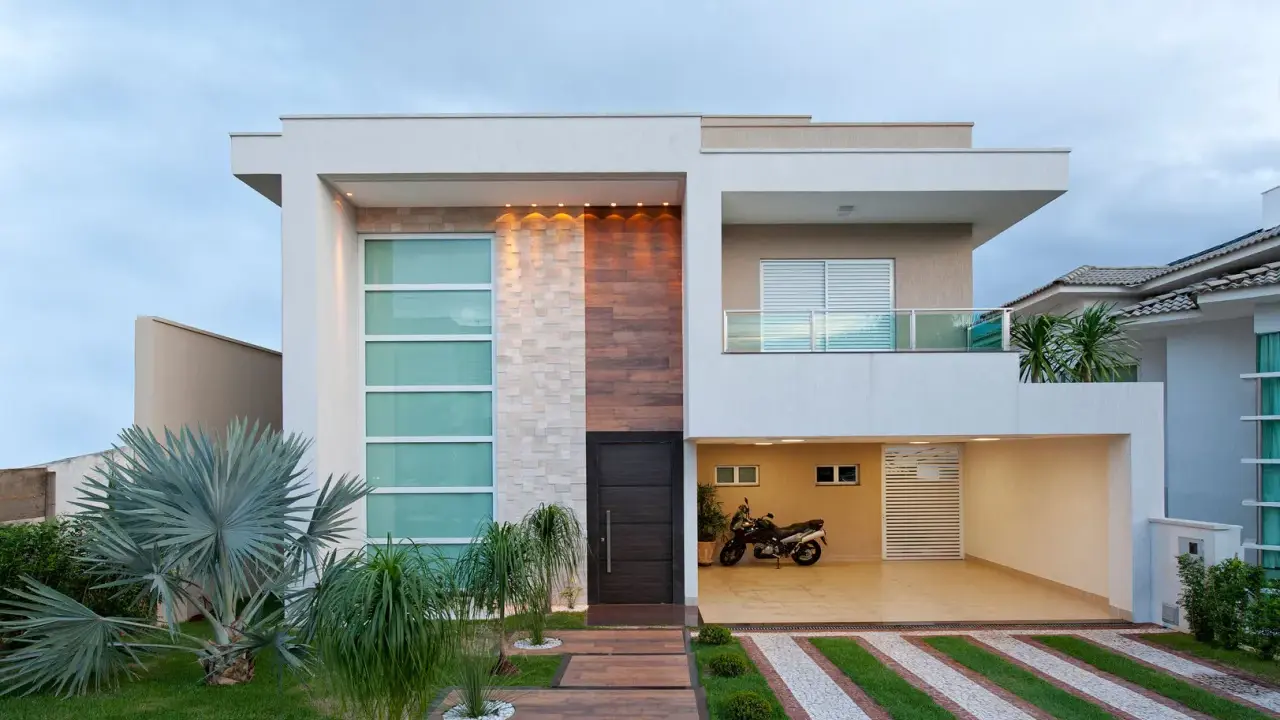 Una casa moderna con líneas limpias y materiales mixtos, que muestra la diversidad de los tipos de casas del mundo.