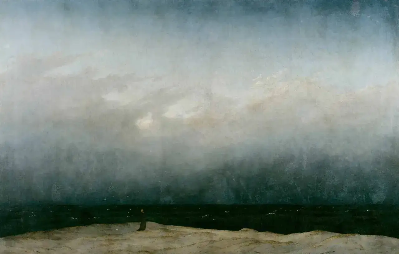 Un hombre solitario contempla el mar embravecido bajo un cielo tormentoso, evocando la melancol&iacute;a rom&aacute;ntica de Caspar David Friedrich.